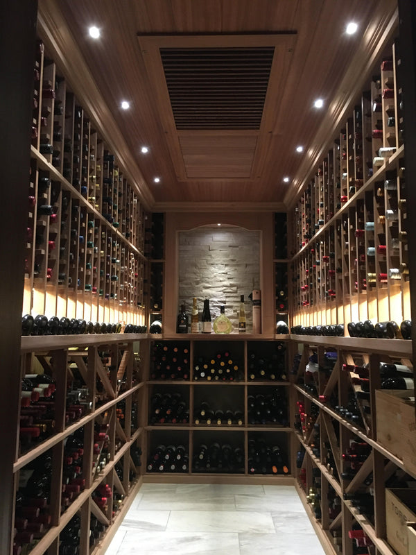 Picture of wine cellar with wooden racks, arch displays, integrated lighting, and a wooden ceiling